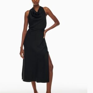 This is a halter cowlneck satin maxi dress with a bias cut and open back.